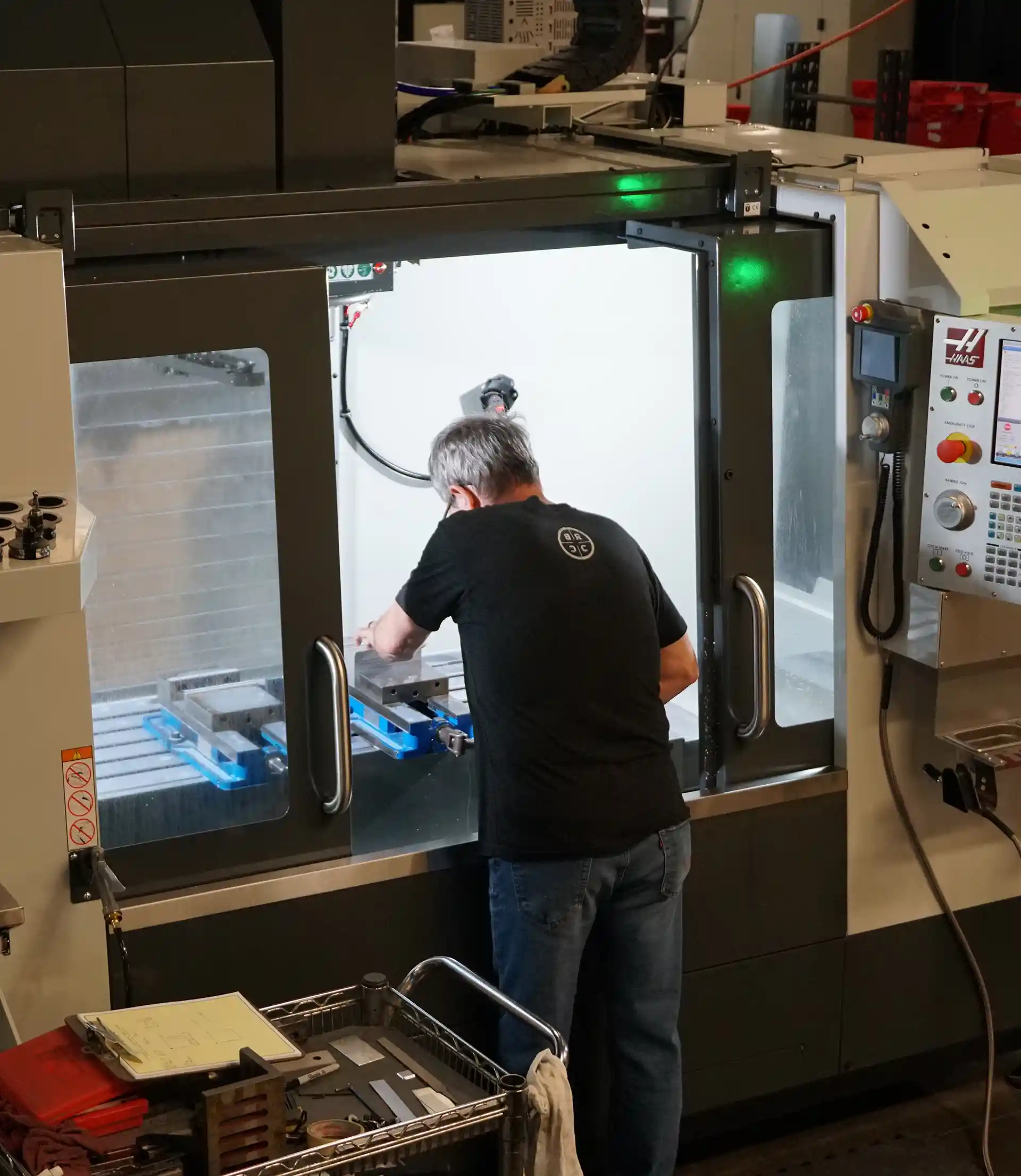 man working with a cnc mill