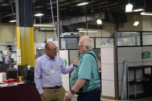 Scott President of Savage with Staff